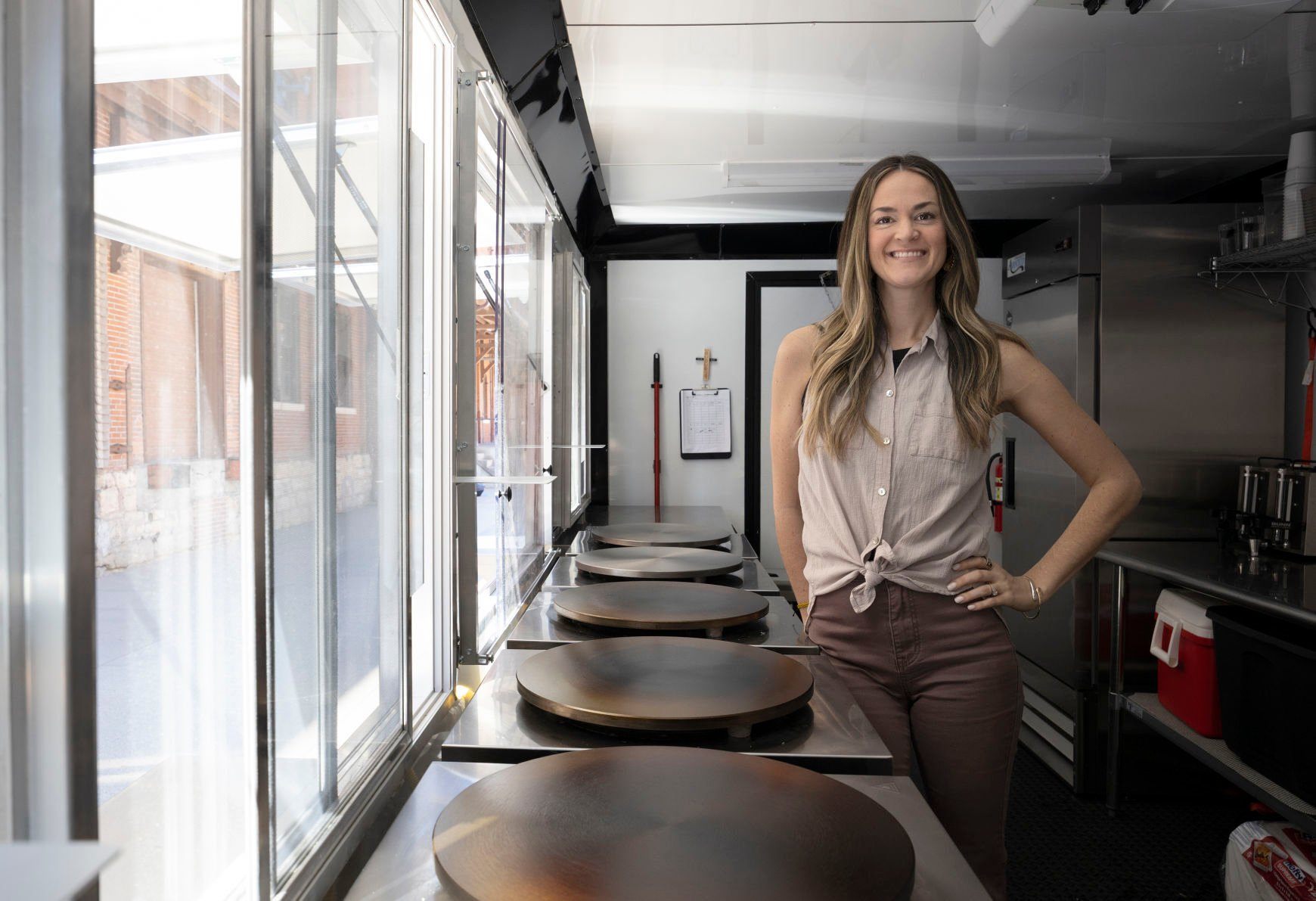 Owner Sarah Goodall stands inside the mobile kitchen of The Crepe Iron in Dubuque on Thursday.    PHOTO CREDIT: Stephen Gassman