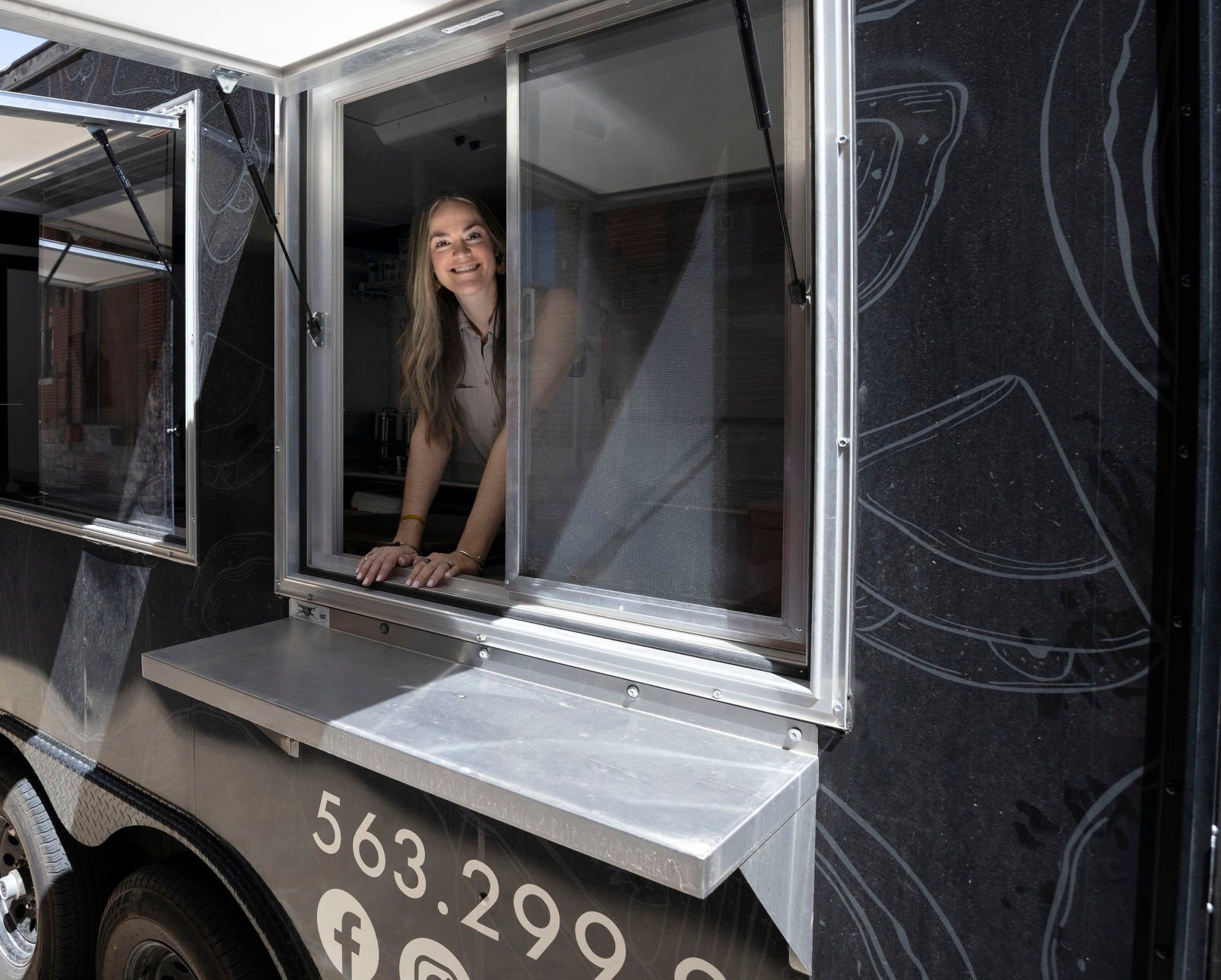 Owner Sarah Goodall stands inside the mobile kitchen of The Crepe Iron in Dubuque on Thursday, April 21, 2022.    PHOTO CREDIT: Stephen Gassman