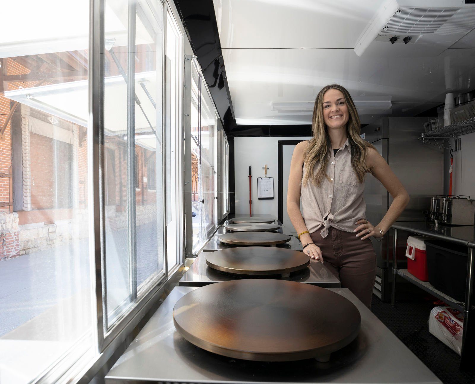 Owner Sarah Goodall stands inside the mobile kitchen of The Crepe Iron in Dubuque on Thursday, April 21, 2022.    PHOTO CREDIT: Stephen Gassman