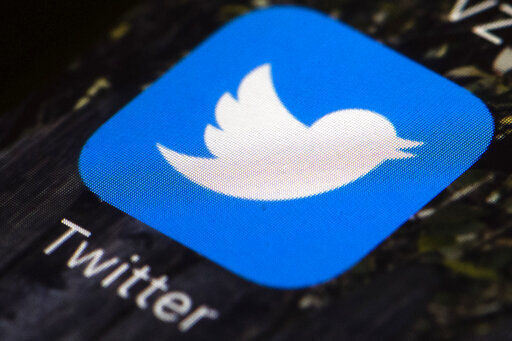 FILE - In this April 26, 2017, file photo is a Twitter app icon on a mobile phone in Philadelphia. If Elon Musk and Twitter get their way, the company will soon be privately held and under his control. The most obvious immediate change would likely be Twitter