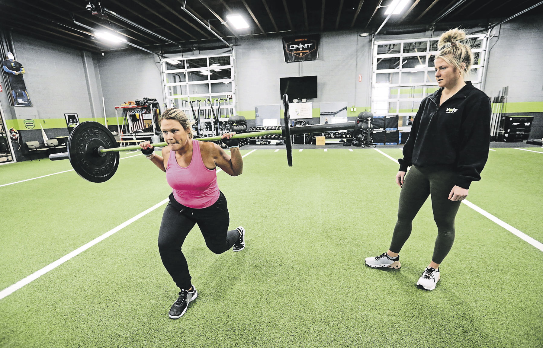 Personal trainer Cassie Hamer (right) works with Vanessa Cahill, of Maquoketa, Iowa, at Volv Fitness.    PHOTO CREDIT: JESSICA REILLY
