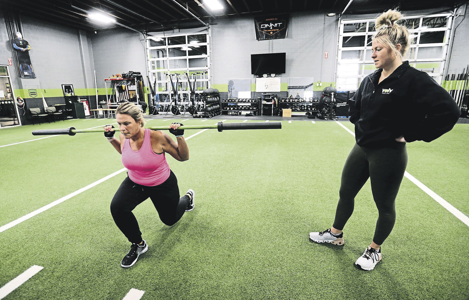 Personal trainer Cassie Hamer (right) works with Vanessa Cahill, of Maquoketa, Iowa, at Volv Fitness in Dubuque on Thursday, March 31, 2022.    PHOTO CREDIT: JESSICA REILLY