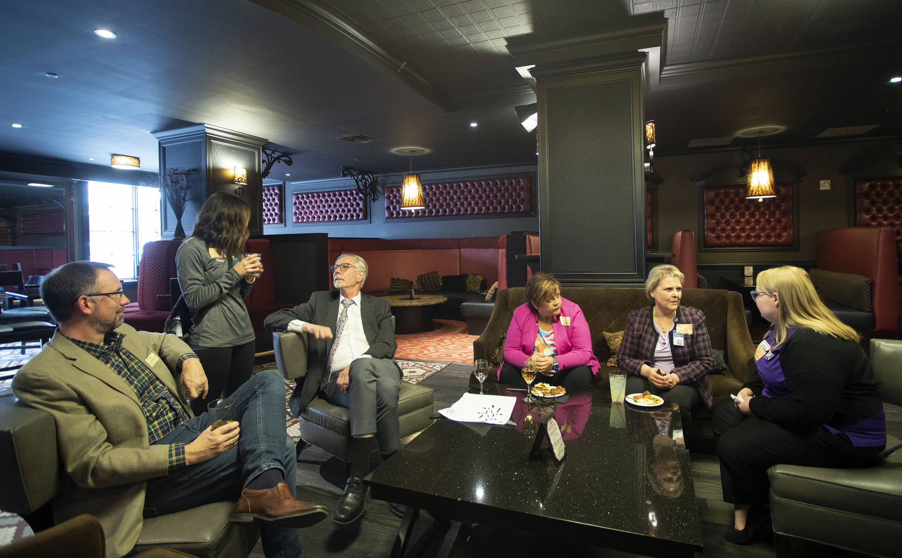 Local business leaders mingle during the Executive Meet and Greet in the Riverboat Lounge in Hotel Julien Dubuque on Tuesday, April 19, 2022.    PHOTO CREDIT: Stephen Gassman