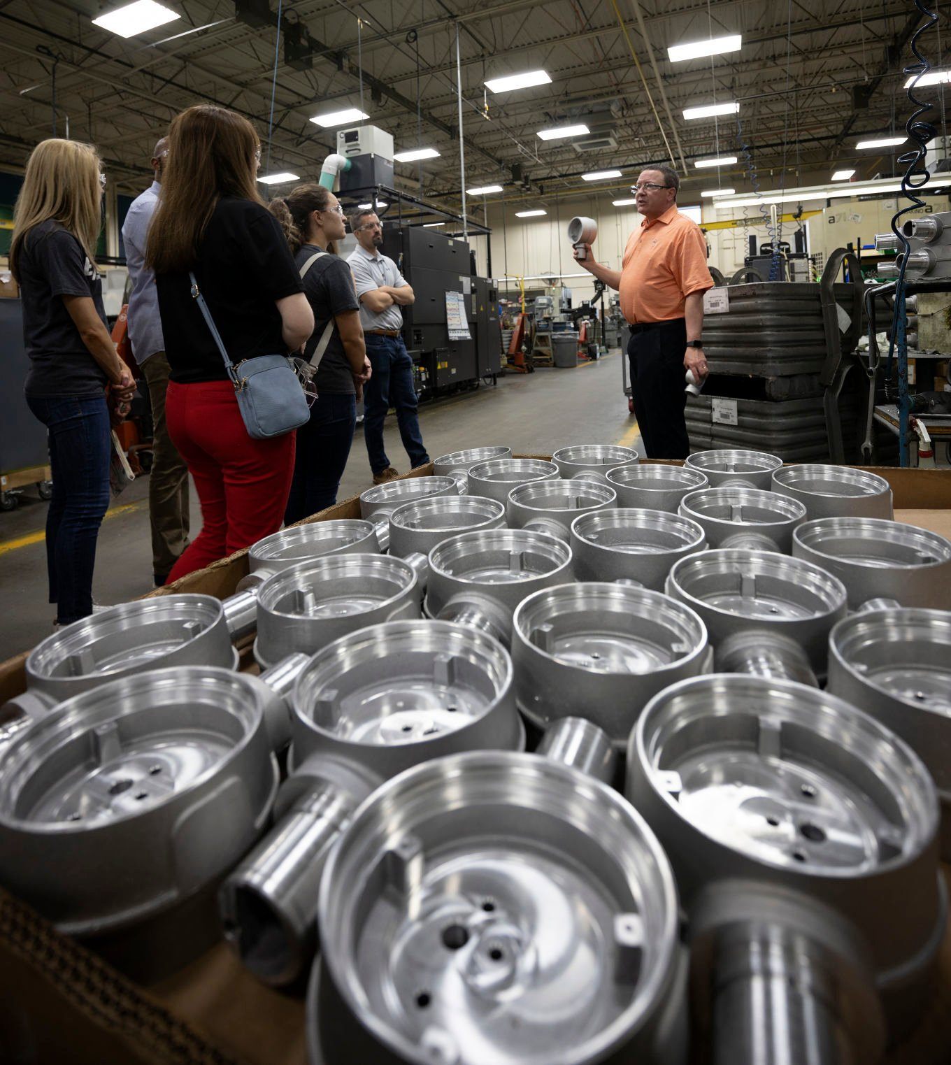 Morrison Bros. Co. Director of Manufacturing Rick Zillig talks about some of the parts made at the longtime Dubuque company during a Dubuque Area Chamber of Commerce Manufacturing Appreciation Week event on Tuesday.    PHOTO CREDIT: Stephen Gassman