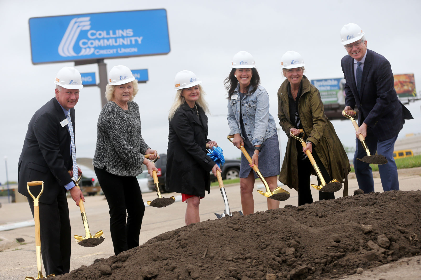 John Lewis (from left), senior vice president of IT and facilities at Collins Community Credit Union; Marsha Schulte, chair of the board of directors for Collins; Stefanie Rupert, president and CEO of the credit union; Lindsey Dozier, vice president of retail for Collins; Molly Grover, president and CEO of Dubuque Area Chamber of Commerce; and Rick Dickinson, president and CEO of Greater Dubuque Development Corp., participate in a groundbreaking for the credit union