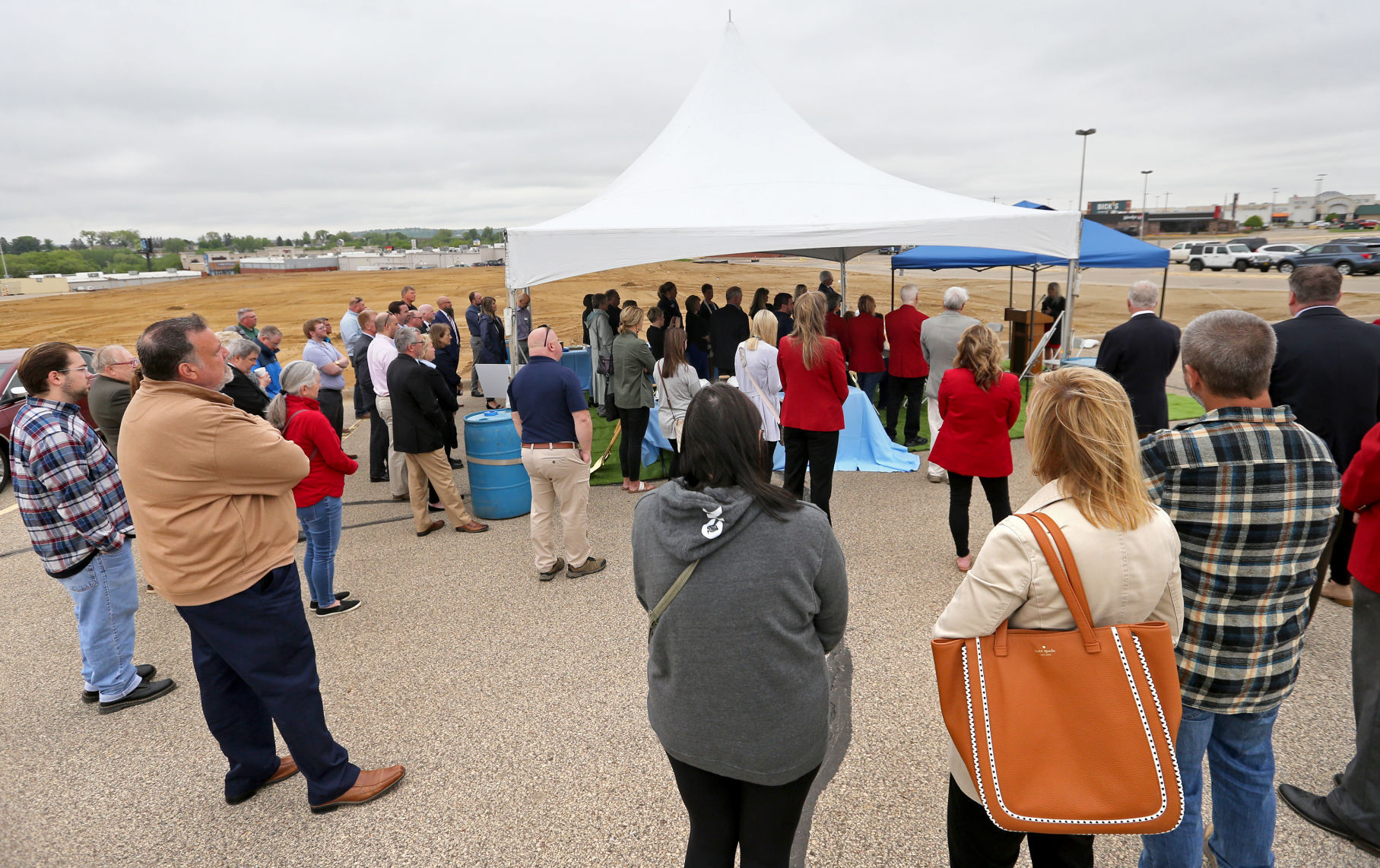 People attend a groundbreaking for Collins Community Credit Union