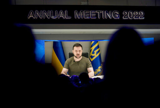 Ukrainian President Volodymyr Zelenskyy displayed on a screen as he addresses the audience from Kyiv on a screen during the World Economic Forum in Davos, Switzerland, Monday, May 23, 2022. The annual meeting of the World Economic Forum is taking place in Davos from May 22 until May 26, 2022. (AP Photo/Markus Schreiber)    PHOTO CREDIT: Markus Schreiber