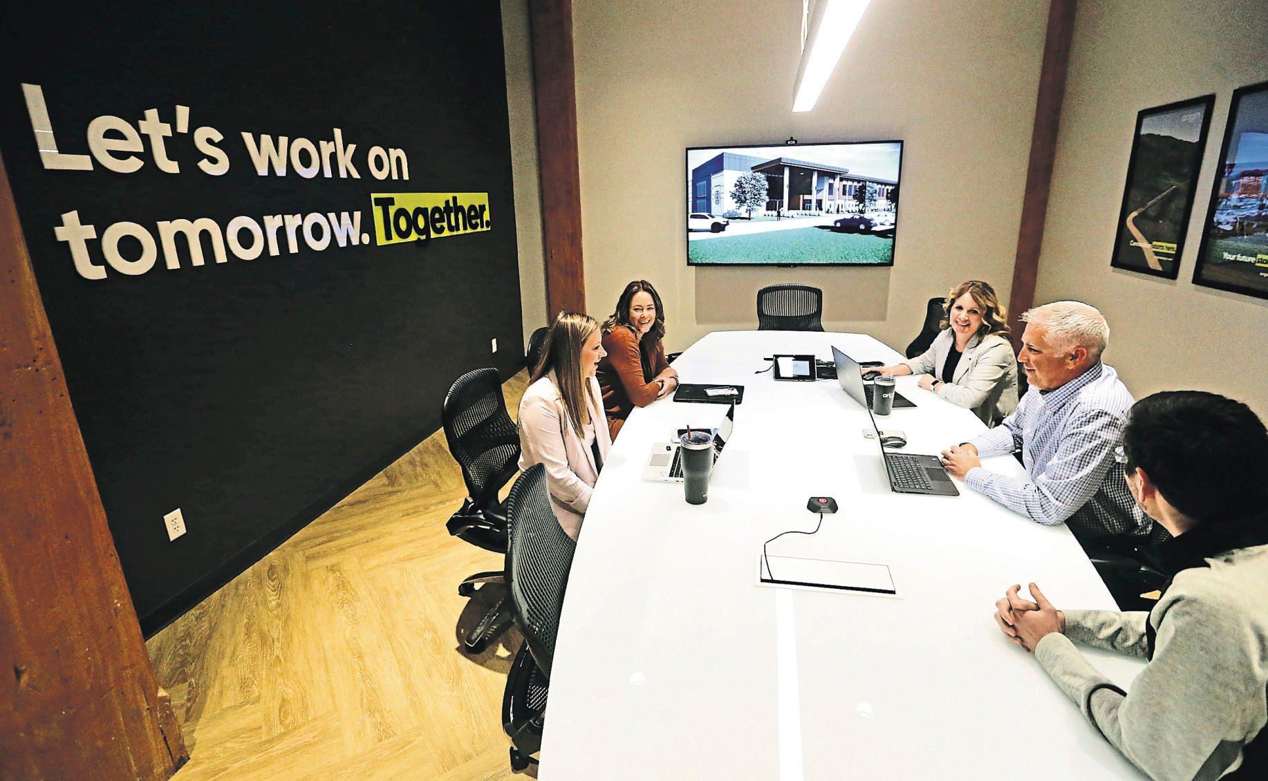Codi Putnam (from left), Lauren Ray, Brenda Ritt, Pat Ready and Zach Thielen discuss topics during a meeting at Origin Design in Dubuque on Tuesday, May 24, 2022.    PHOTO CREDIT: JESSICA REILLY