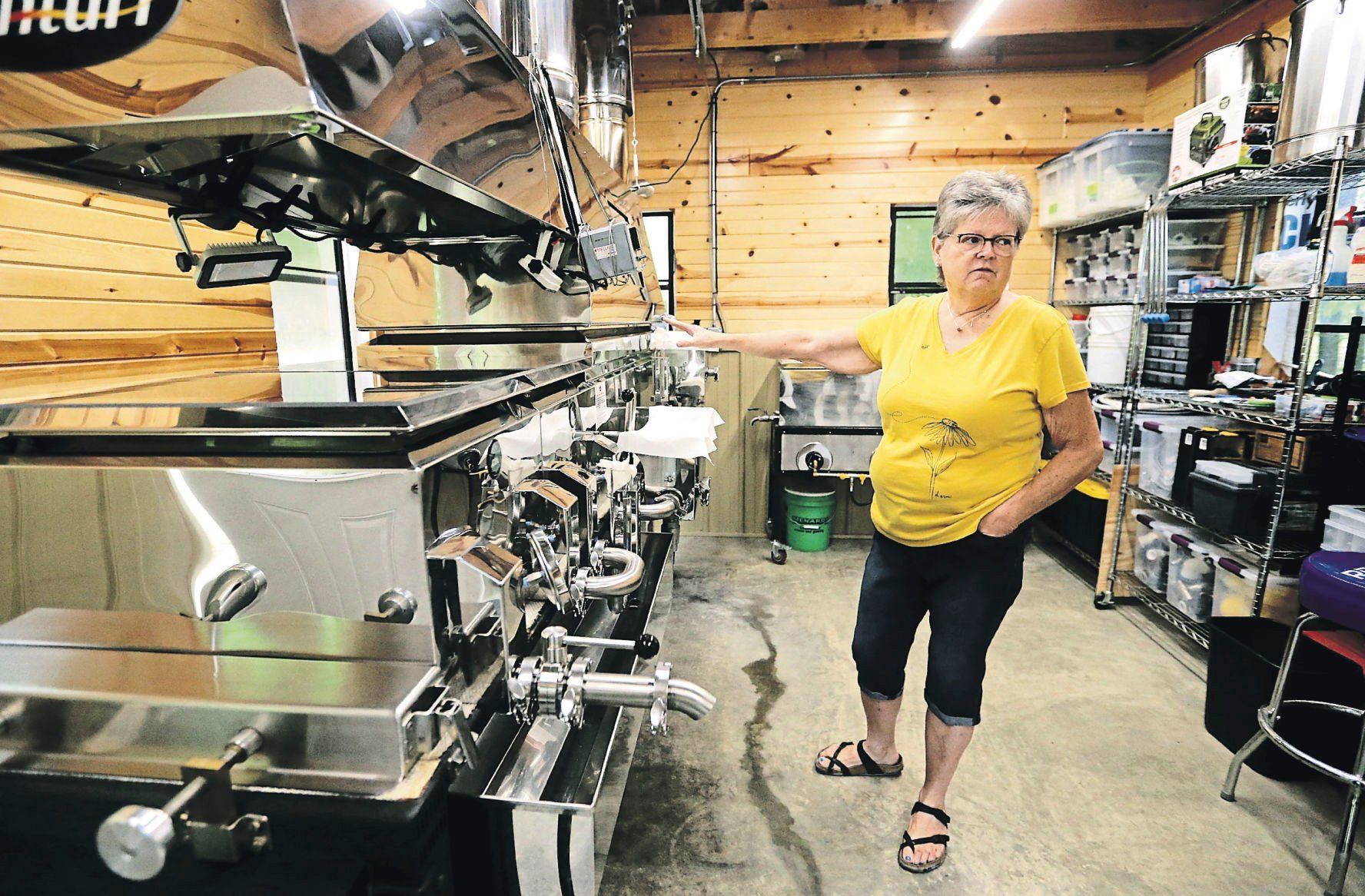 Deb Zenner describes the process of making maple syrup at Timber Range Farm in Durango, Iowa. Deb and her husband started the farm in 2016 and their products are available at many area markets.    PHOTO CREDIT: JESSICA REILLY
