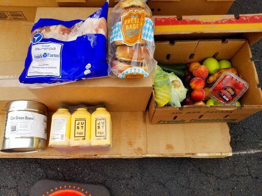 In this image provided by the Northern Illinois Food Bank, food items from the Northern Illinois Food Bank are ready to be handed out on May 26, 2022, in Rockford, Ill. Americans at the low end of the income rung are once again struggling to make ends meet. A confluence of factors — the expiration of federal stimulus checks and surging inflation on staples like gas and food — are driving an even bigger wedge between the haves and have-nots. (Northern Illinois Food Bank via AP)    PHOTO CREDIT: HONS