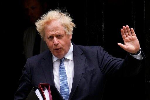 FILE - British Prime Minister Boris Johnson leaves 10 Downing Street to attend the weekly Prime Minister