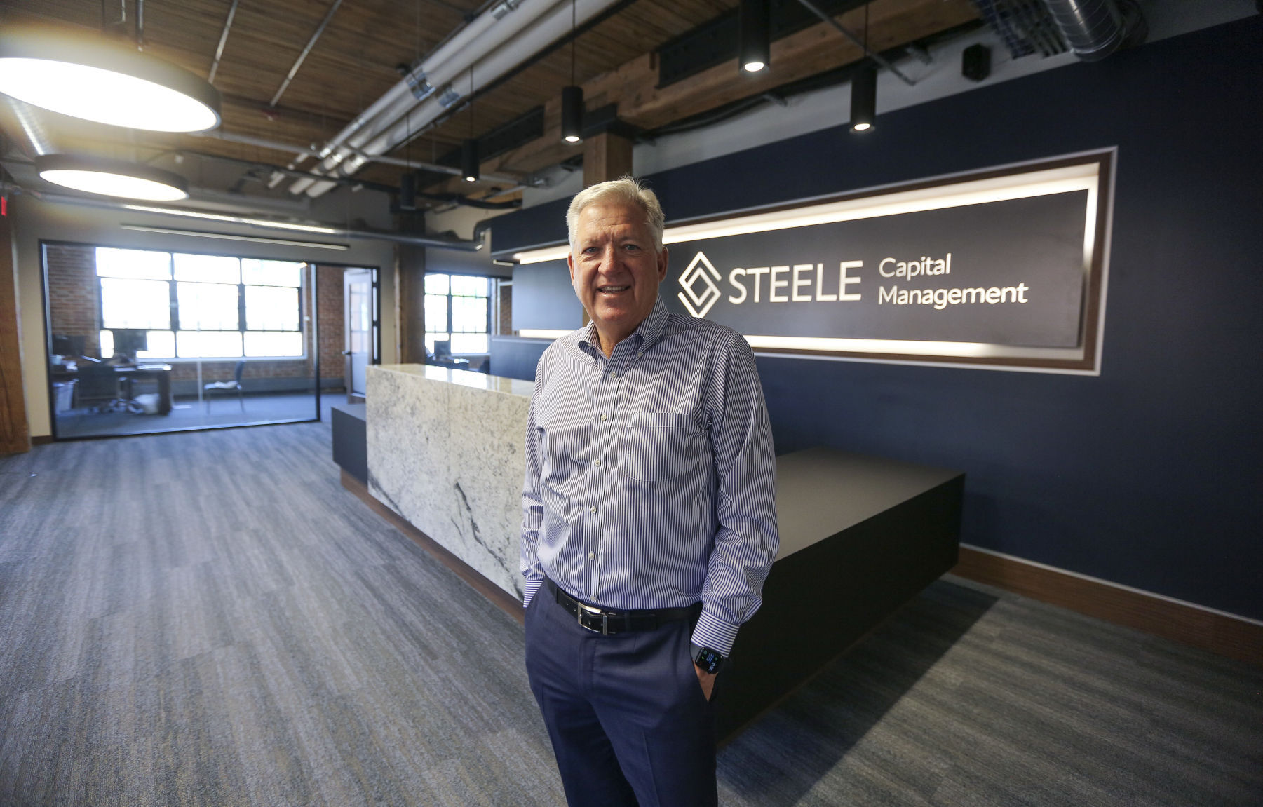 Steele Capital Management CEO Michael Steele inside the new office at the Dupaco Voices Building at 1000 Jackson St., on Thursday, June 2, 2022.    PHOTO CREDIT: Dave Kettering