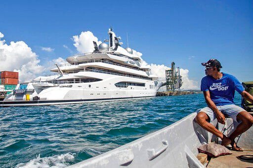 Boat captain Emosi Dawai looks at the superyacht Amadea where it is docked at the Queens Wharf in Lautoka, Fiji. The United States has won a legal battle to seize the Russian-owned superyacht and wasted no time in taking command of the vessel and sailing it away from the South Pacific nation.    PHOTO CREDIT: Leon Lord