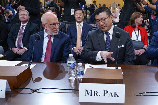 Benjamin Ginsberg, Washington attorney and elections lawyer, left, and BJay Pak, former U.S. Attorney in Atlanta, talk before they are sworn in to testify as the House select committee investigating the Jan. 6 attack on the U.S. Capitol continues to reveal its findings of a year-long investigation, at the Capitol in Washington, Monday, June 13, 2022. (AP Photo/Susan Walsh)    PHOTO CREDIT: Susan Walsh