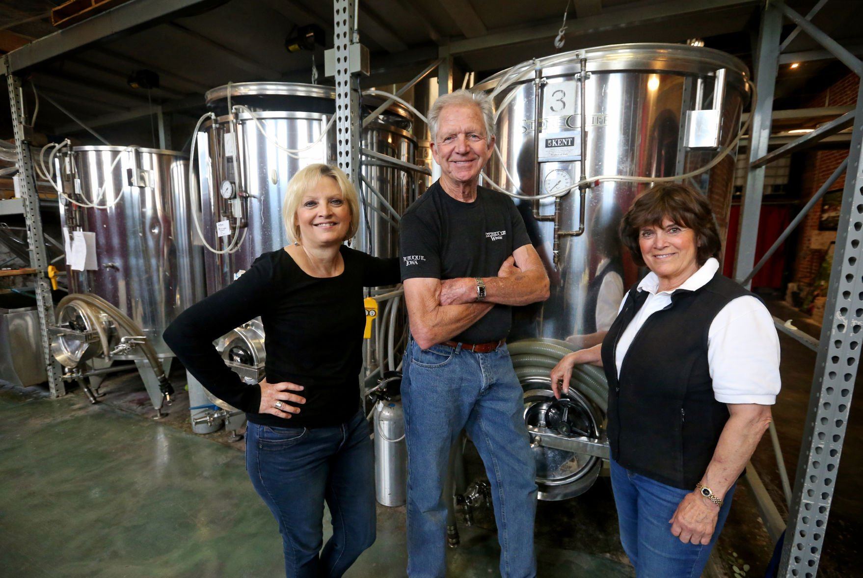 Dubuque Star Brewery co-owners Jodi Bryson (from left), Bob Smith and Nan Smith stand at Stone Cliff Winery in Dubuque on Friday, June 10, 2022. Stone Cliff, located in the historic Dubuque Star Brewery building, plans to start selling Dubuque Star Beer.    PHOTO CREDIT: JESSICA REILLY