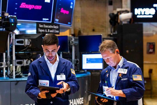 Traders Orel Partush (left) and Robert Charmak work on the floor of the New York Stock Exchange. Wall Street is back in the claws of a bear market as worries about inflation and higher interest rates overwhelm investors. A bear market is a term used by Wall Street when an index like the S&P 500, the Dow Jones Industrial Average, or even an individual stock, has fallen 20% or more from a recent high for a sustained period of time.    PHOTO CREDIT: David L. Nemec