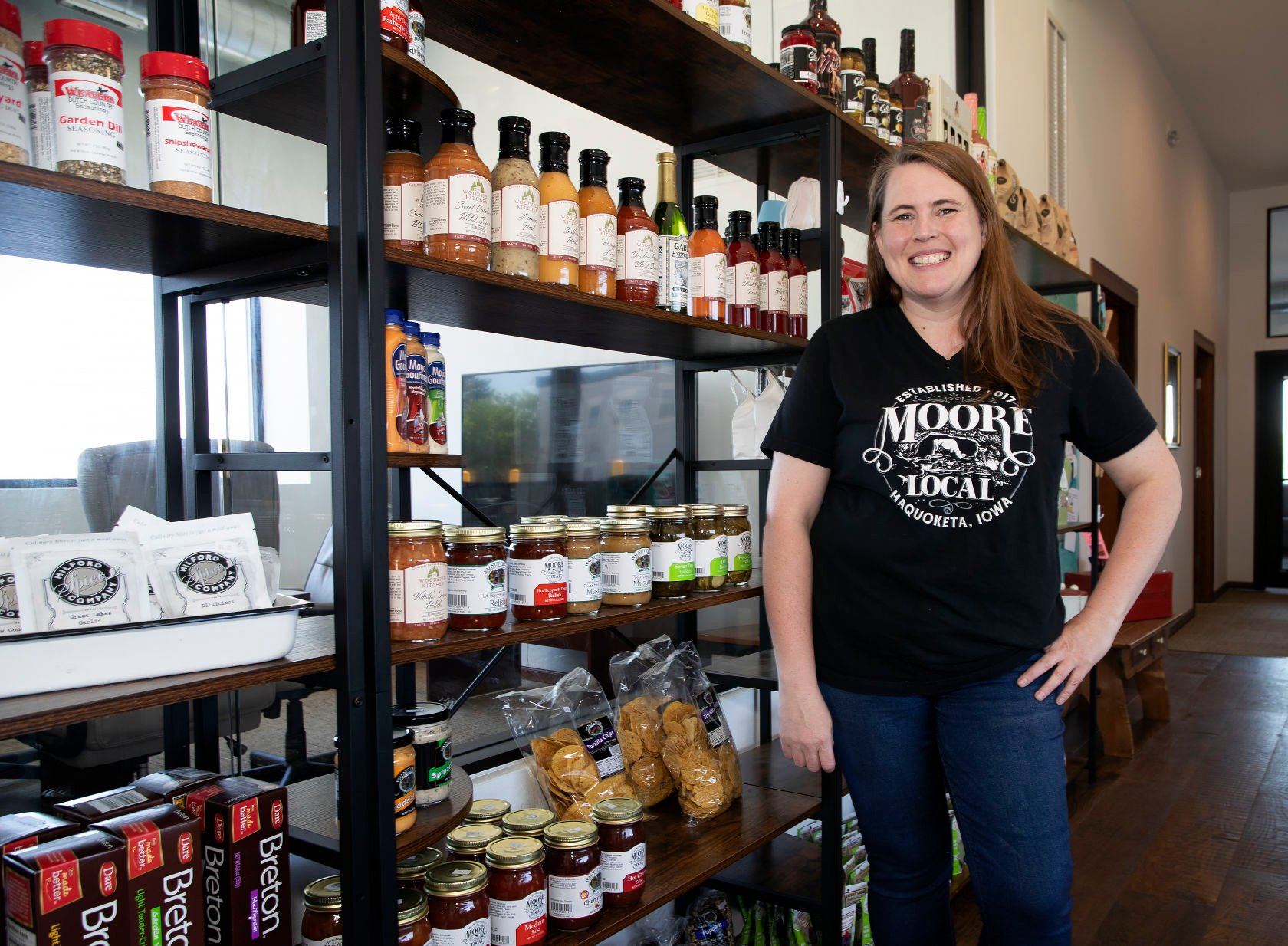 Owner Heather Moore stands inside the current location of Moore Local at 305 S. Riverview St. in Bellevue, Iowa, on Thursday. Moore Local will soon relocate to another storefront on Riverview Street.    PHOTO CREDIT: Stephen Gassman