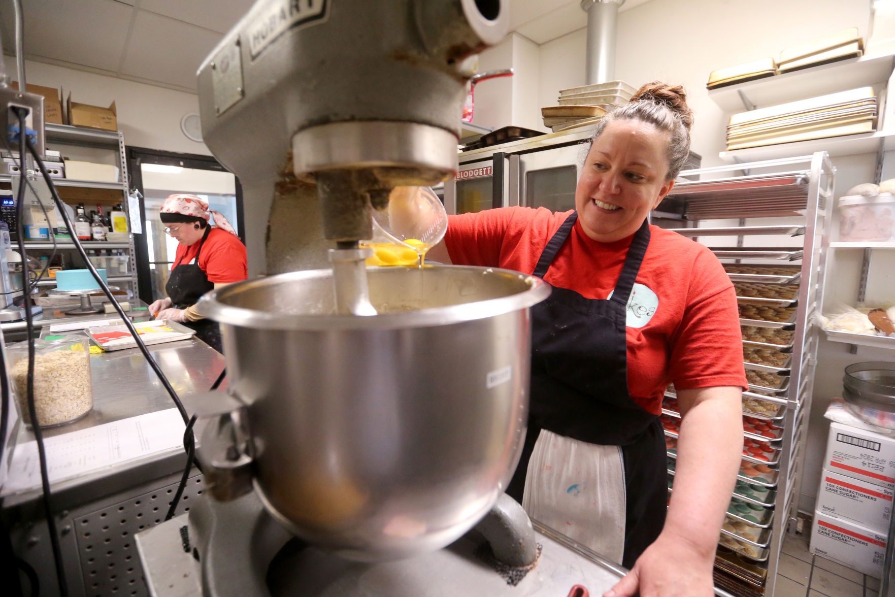 Chloe Norpel prepares cookie batter at Candle Ready Cakes in Dubuque on Thursday, June 23, 2022. The store plans to move to a new, larger location at 249 W. First St. in Dubuque.    PHOTO CREDIT: JESSICA REILLY