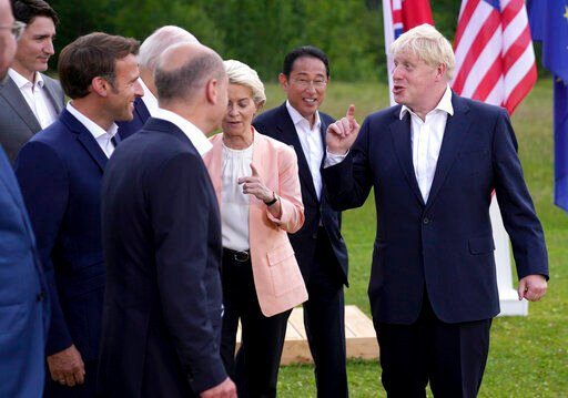 British Prime Minister Boris Johnson, right, speaks with, from left, European Council President Charles Michel, Canada
