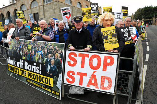 Demonstrators protest outside Hillsborough Castle in Hillsborough, Northern Ireland in May. Britain is pressing on with a plan to rip up parts of the post-Brexit trade deal it signed with the bloc European Union. Legislation that rewrites trade rules for Northern Ireland is scheduled to get its first major House of Commons debate today.    PHOTO CREDIT: Peter Morrison