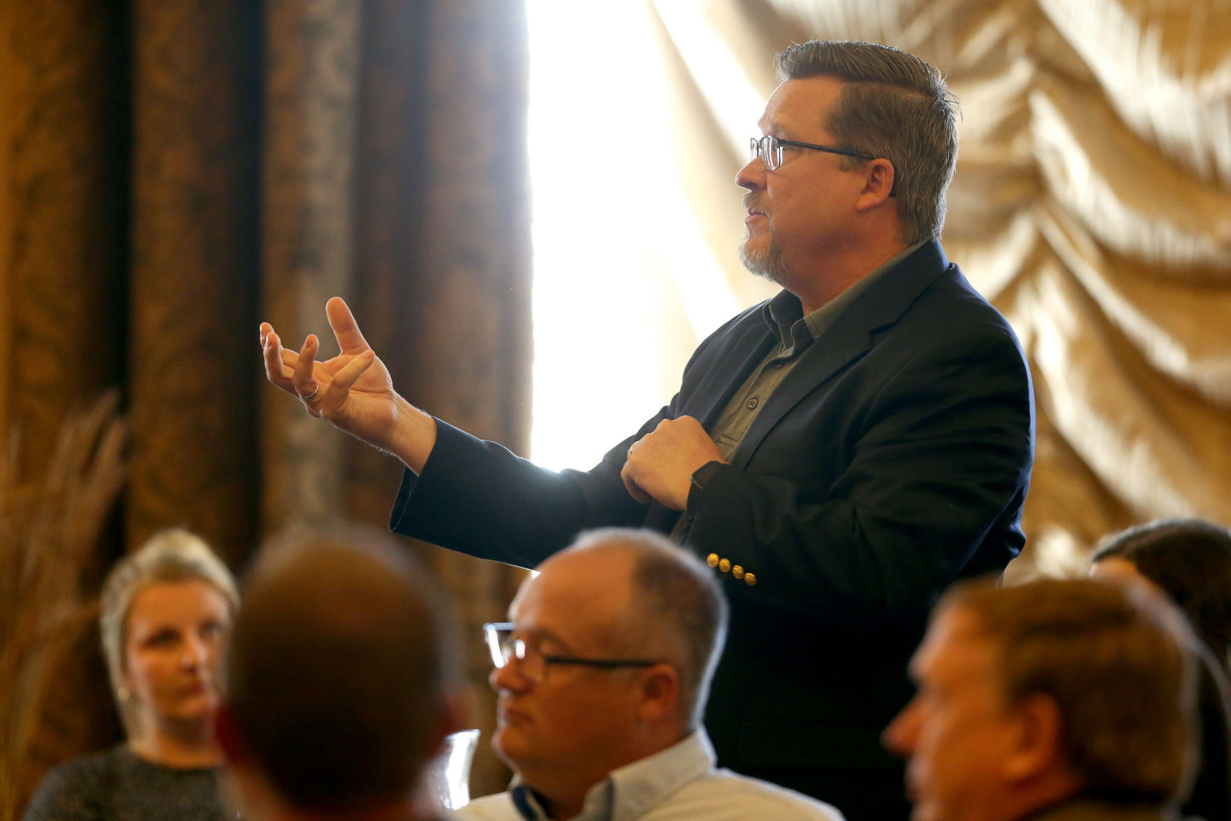 Brian Schatz, chief operating officer at Medical Associates, asks a question during the Dubuque Area Chamber of Commerce