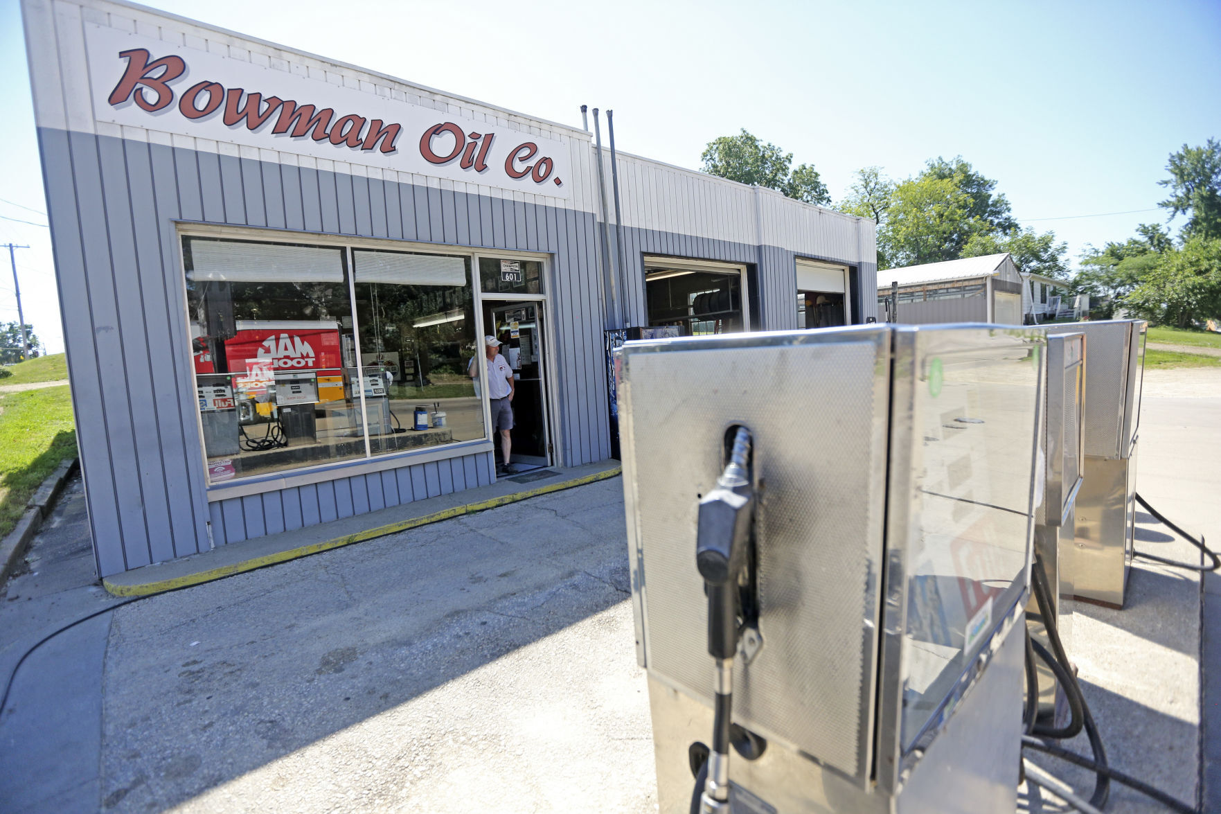 Owner of Bowman Oil Co., Bill Bowman stands in the doorway of the Maquoketa, Iowa business on Wednesday, June 29, 2022. The gas station closed its doors for good on Thursday.    PHOTO CREDIT: Dave Kettering