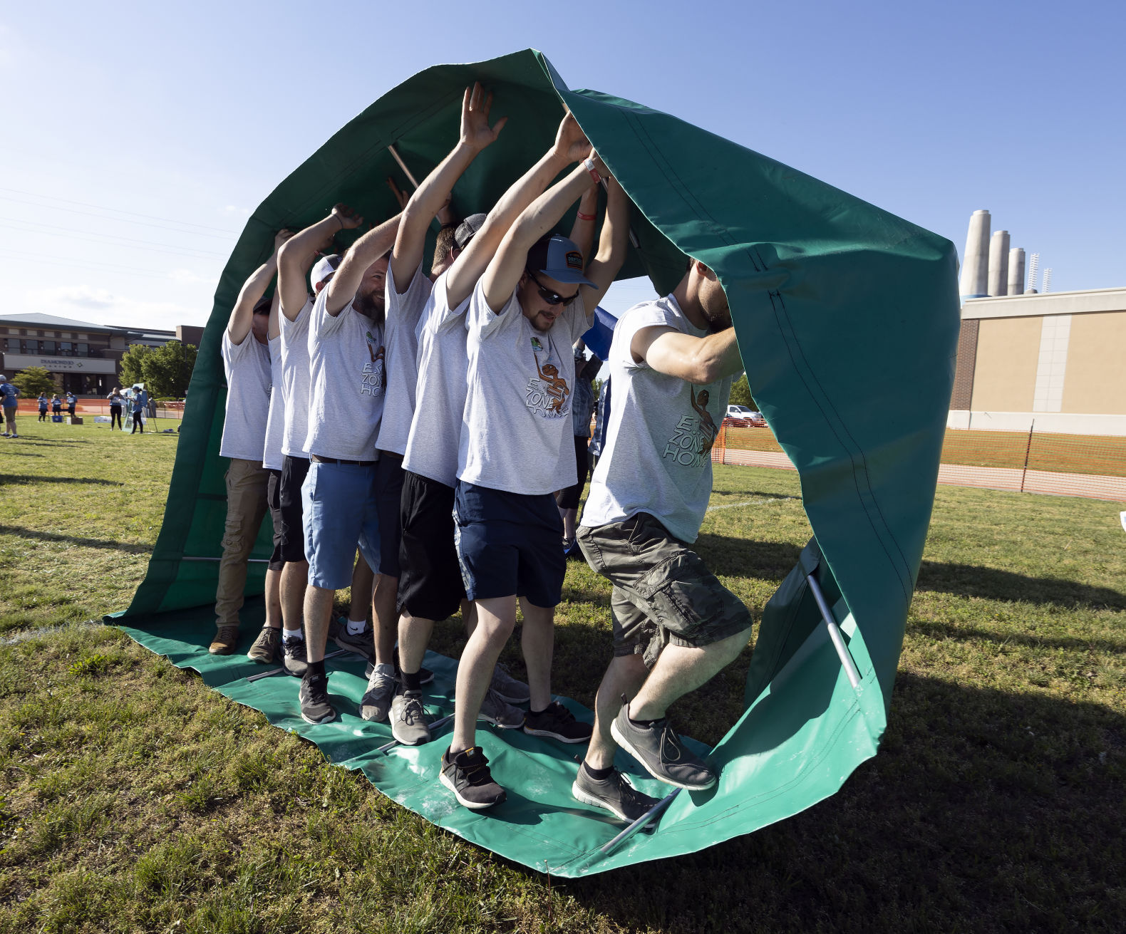 Members of team All Seasons compete in a centipede game at the Area Residential Care Corporate and Community game night at the Port of Dubuque on Friday, June 10, 2022.    PHOTO CREDIT: Stephen Gassman