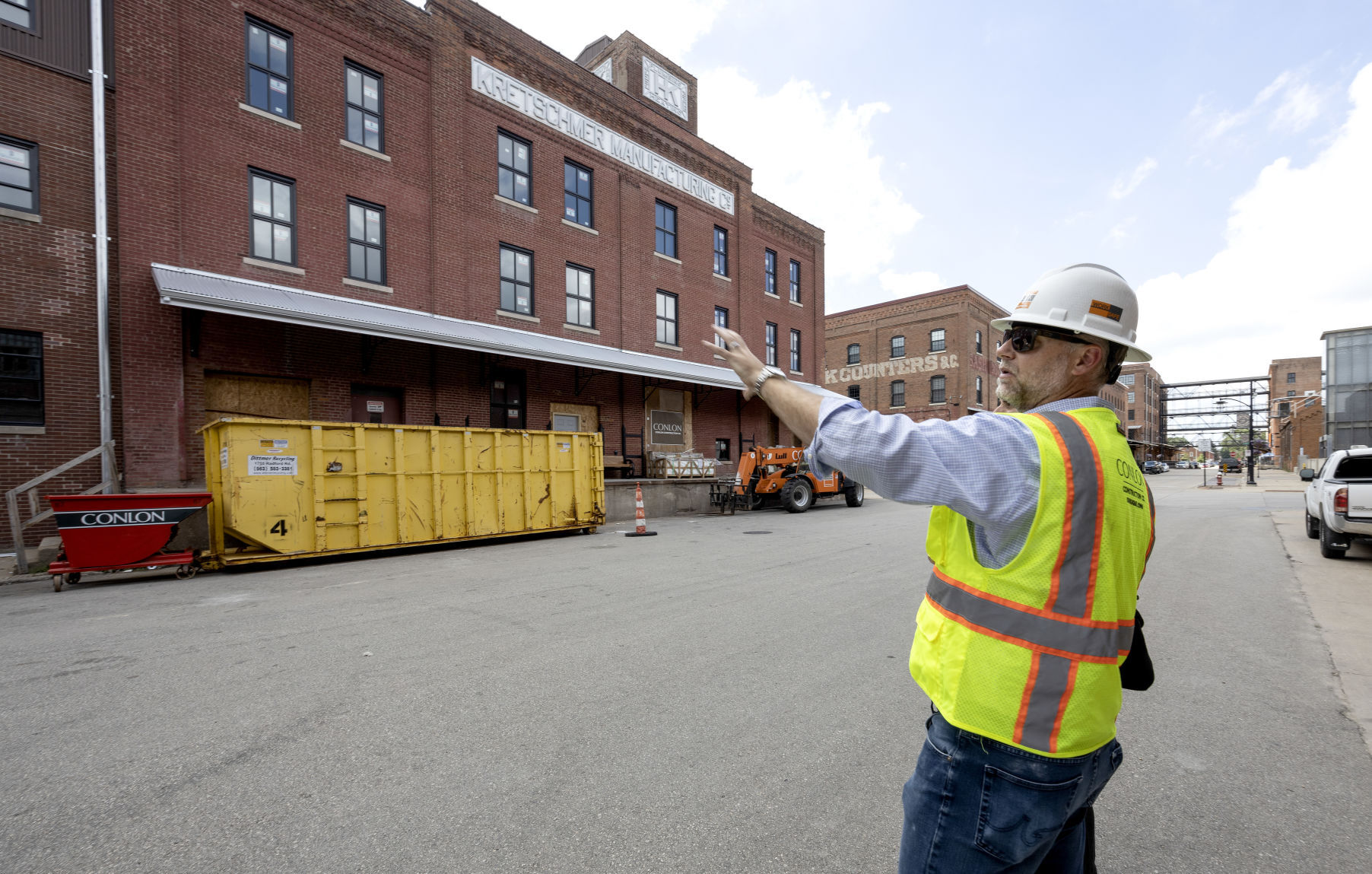 Conlon Construction President and Chief Operating Officer Matt Mulligan points out areas of the Kretschmer Manufacturing building, 220 E. Ninth St., on Thursday, July 7, 2022. The building will be home to 48 apartment units.    PHOTO CREDIT: Stephen Gassman