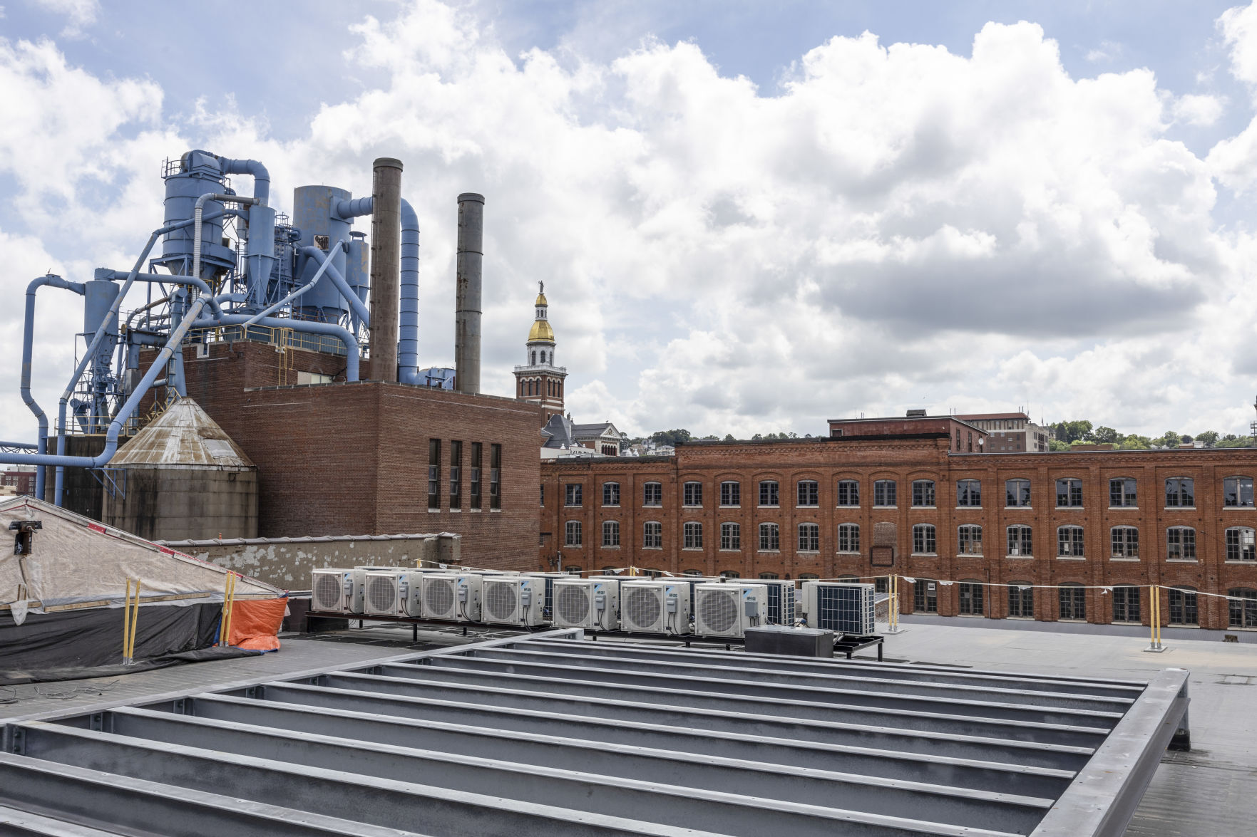 A rooftop view of the Kretschmer Manufacturing building at 220 E. Ninth St. that is being refurbished into apartments. Photo taken on Thursday, July 7, 2022.    PHOTO CREDIT: Stephen Gassman