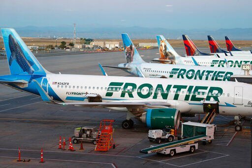 FILE - In this Sept. 22, 2019, file photo, Frontier Airlines airliners stand at gates at Denver International Airport in Denver, Colo. Spirit Airlines announced on Thursday, July 7, 2022, that it would again postpone a vote on the proposed merger with Frontier, a sign that it lacks shareholder support for the merger in the face of a rival bid by JetBlue Airways. Spirit delayed the vote by a week, until July 15. (AP Photo/David Zalubowski, File)    PHOTO CREDIT: David Zalubowski