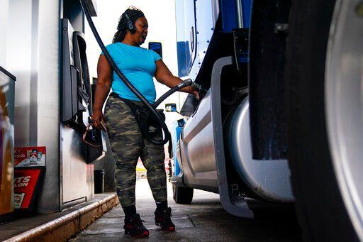 Delores Bledsoe, of Houston, Texas, fuels up her rig at a truck stop in Carlisle, Pa. Inflation at the wholesale level climbed 11.3% in June compared with a year earlier, the latest painful reminder that inflation is running hot through the American economy. The U.S. producer price index — which measures inflation before it hits consumers — rose at the fastest pace since hitting a record 11.6% in March.     PHOTO CREDIT: Matt Rourke