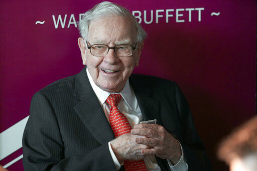 FILE - Warren Buffett, chairman and CEO of Berkshire Hathaway, smiles as he plays bridge following the annual Berkshire Hathaway shareholders meeting in Omaha, Neb., on May 5, 2019. Berkshire Hathaway now owns nearly $11 billion worth of Occidental Petroleum stock after buying another 1.9 million shares in the past week. The latest purchases of nearly $117 million in stock that Berkshire reported to the Securities and Exchange Commission on Monday, July 18, 2022, give the Omaha, Nebraska-based conglomerate control of 19.4% of the oil producer