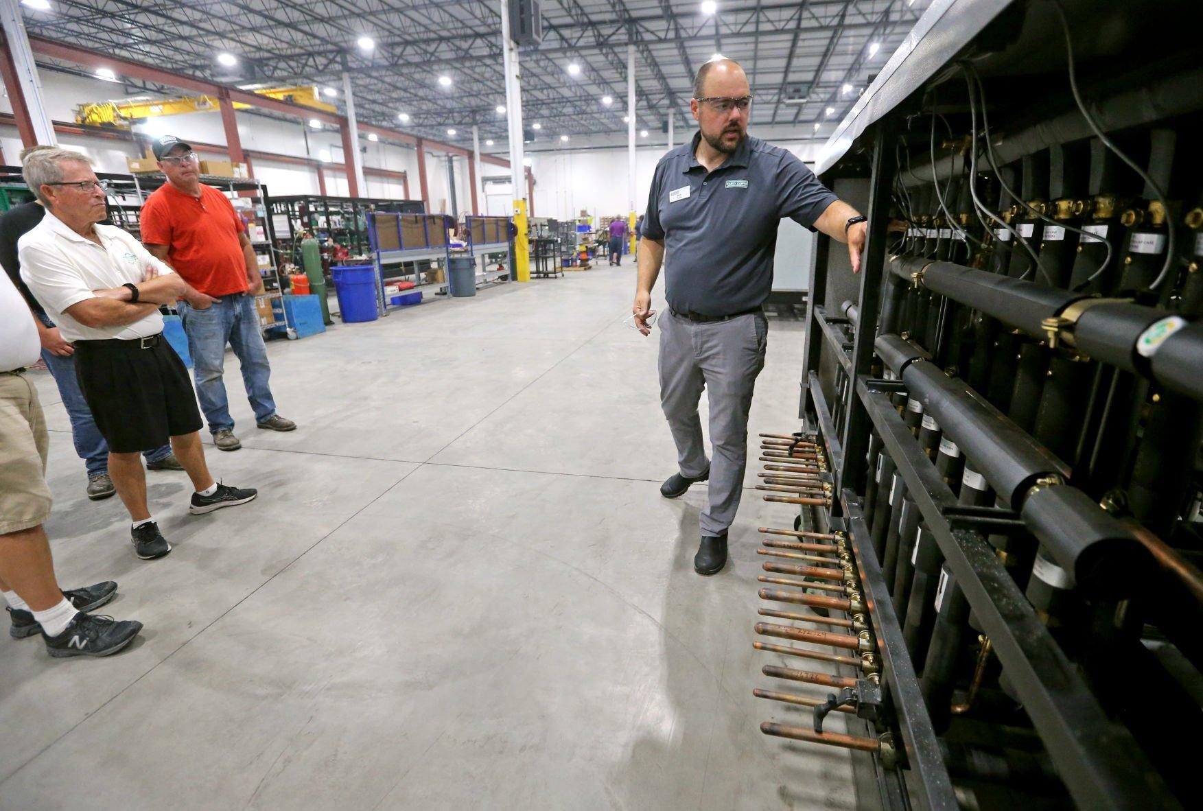 Ben Fisher (right) gives a tour of Zero Zone during an event at the facility in Dyersville, Iowa, on Wednesday, July 20, 2022.    PHOTO CREDIT: JESSICA REILLY