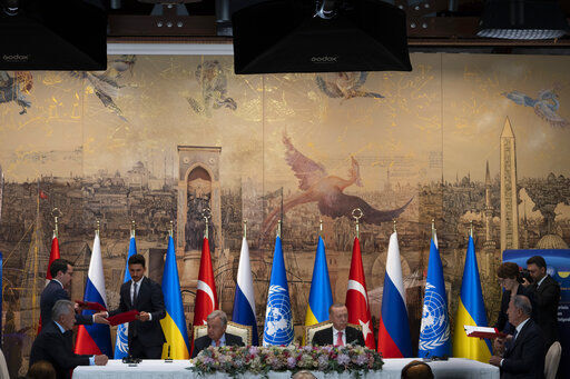 Turkish President Recep Tayyip Erdogan and U.N. Secretary General Antonio Guterres lead a signing ceremony at Dolmabahce Palace in Istanbul, Turkey, Friday, July 22, 2022. U.N. Secretary General Antonio Guterres and Turkish President Recep Tayyip Erdogan were due on Friday to oversee the signing of a key agreement that would allow Ukraine to resume its shipment of grain from the Black Sea to world markets and for Russia to export grain and fertilizers, ending a standoff that has threatened world food security. (AP Photo/Khalil Hamra)    PHOTO CREDIT: Khalil Hamra