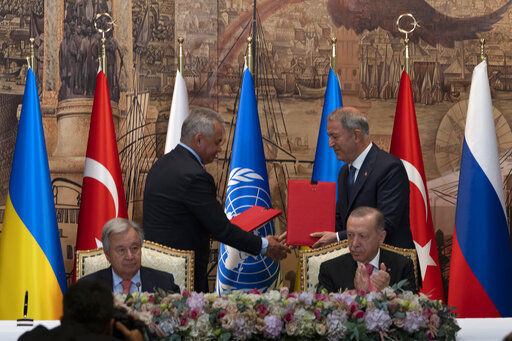 Turkish President Recep Tayyip Erdogan, right, and U.N. Secretary General Antonio Guterres lead a signing ceremony at Dolmabahce Palace in Istanbul, Turkey, Friday, July 22, 2022. U.N. Secretary General Antonio Guterres and Turkish President Recep Tayyip Erdogan were due on Friday to oversee the signing of a key agreement that would allow Ukraine to resume its shipment of grain from the Black Sea to world markets and for Russia to export grain and fertilizers, ending a standoff that has threatened world food security. (AP Photo/Khalil Hamra)    PHOTO CREDIT: Khalil Hamra