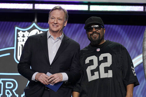 Rapper Ice Cube poses with NFL Commissioner Roger Goodell during the first round of the NFL football draft in April in Las Vegas. The NFL is making its move into offering its own media streaming platform. The league announced that “NFL+” launched today.    PHOTO CREDIT: John Locher