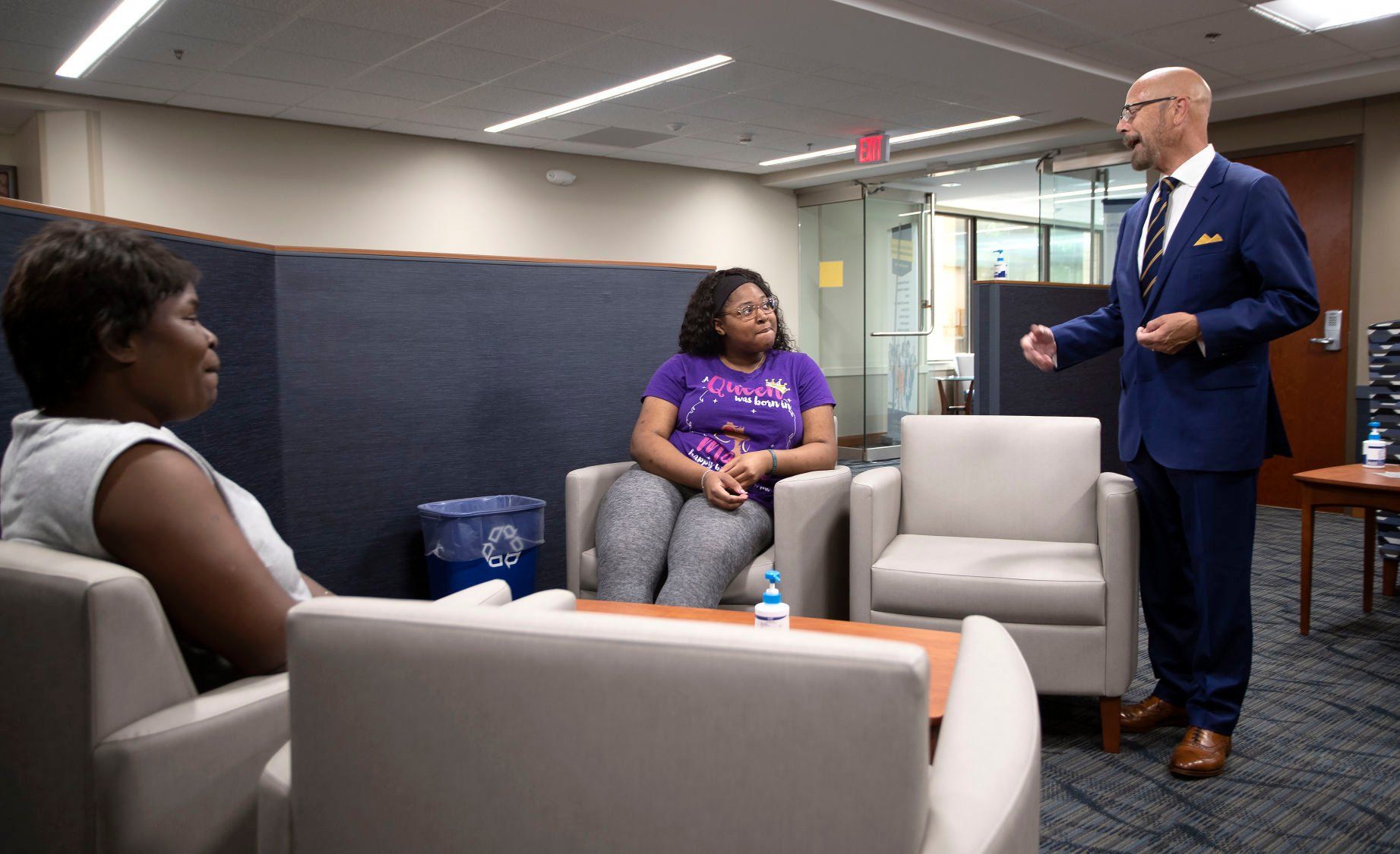 Northeast Iowa Community College President Herbert Riedel (far right) speaks with students Yolanda McDougal (left) and Breonna Doss at the Dubuque campus on Wednesday, June 29, 2022.    PHOTO CREDIT: Stephen Gassman