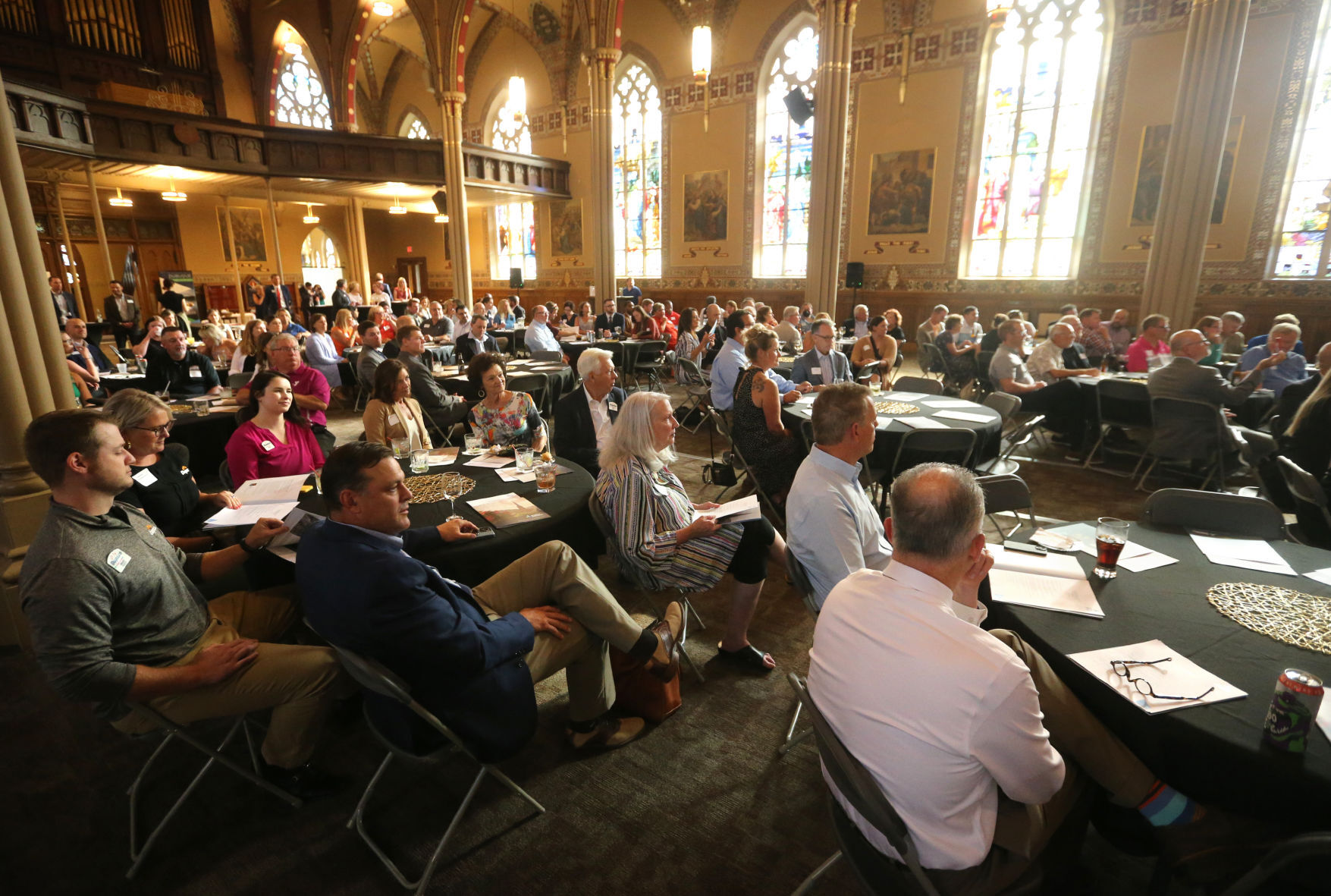 People attend the Greater Dubuque Development Corp. annual meeting at Steeple Square in Dubuque on Thursday, July 21. Officials looked back at the past year and highlighted goals for the next five years.    PHOTO CREDIT: JESSICA REILLY