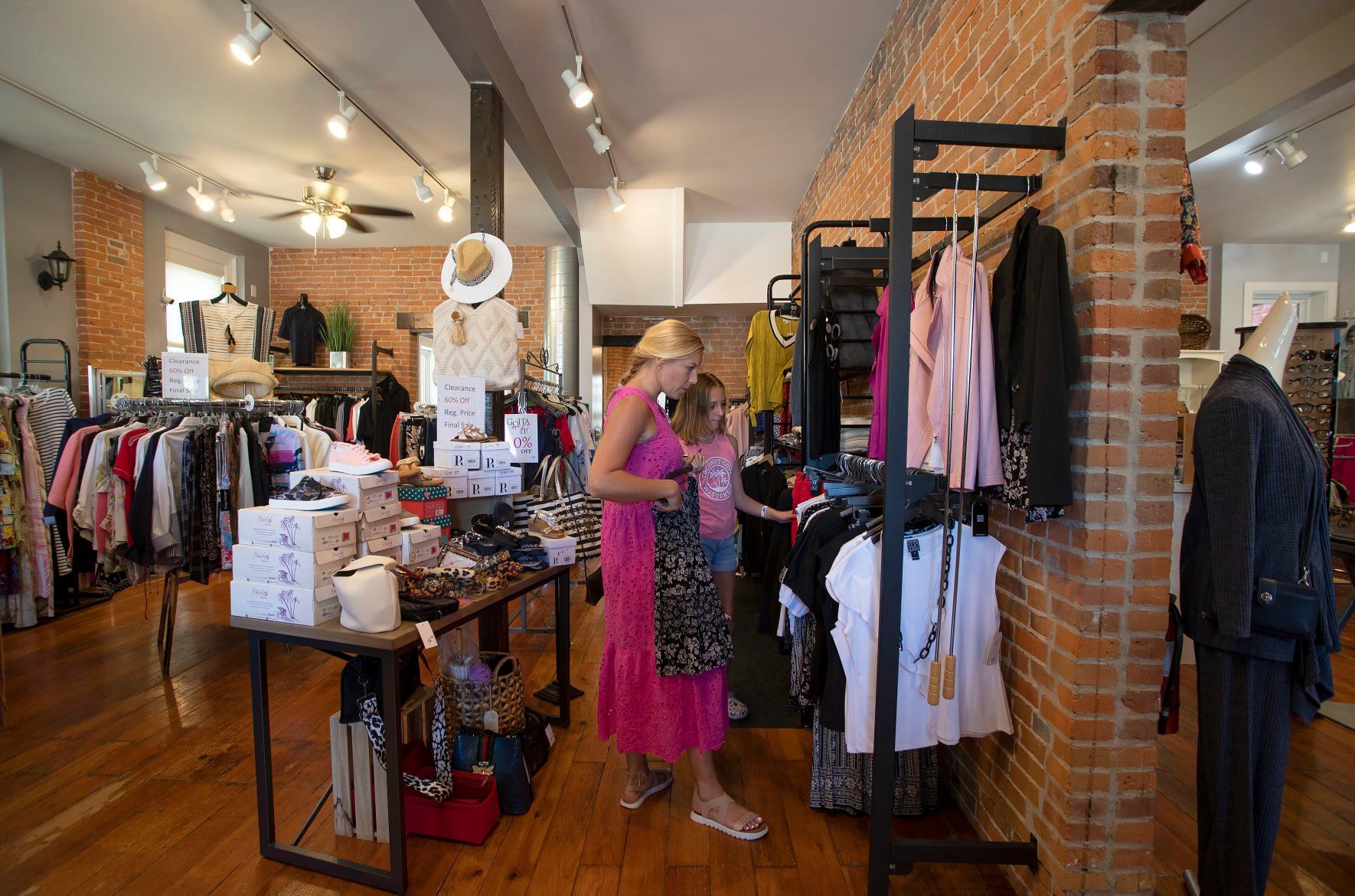 Lauren (left) and Ella Jeager, from Texas, shop at Gotta Have It in Dubuque on Thursday, August 4, 2022.    PHOTO CREDIT: Stephen Gassman
