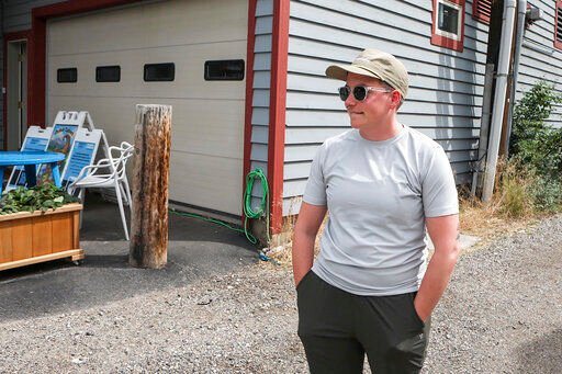 Ash Hermanowski, the food access and operations manager of the Jackson Cupboard, in Jackson Hole, Wyo., hands out meals from a commercial garage downtown after the nonprofit was forced out of a previous location by a malfunctioning sprinkler. As the Federal Reserve