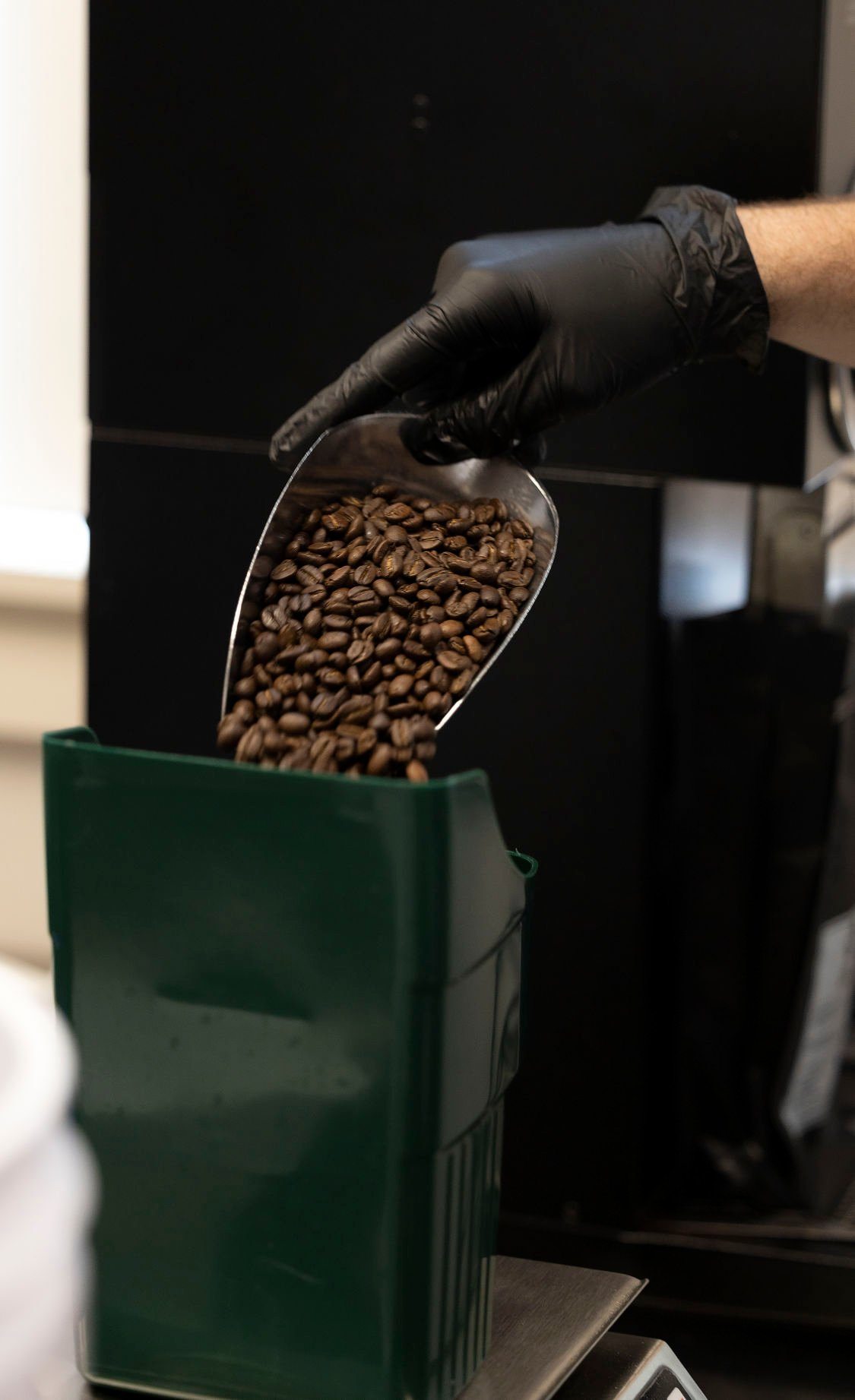Owner Christian McLaughlin weighs beans prior to grinding at Spelunker Coffee Co. in Maquoketa, Iowa.    PHOTO CREDIT: Stephen Gassman
