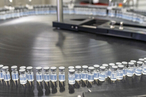 This August 2022 photo provided by Pfizer shows vials of the company