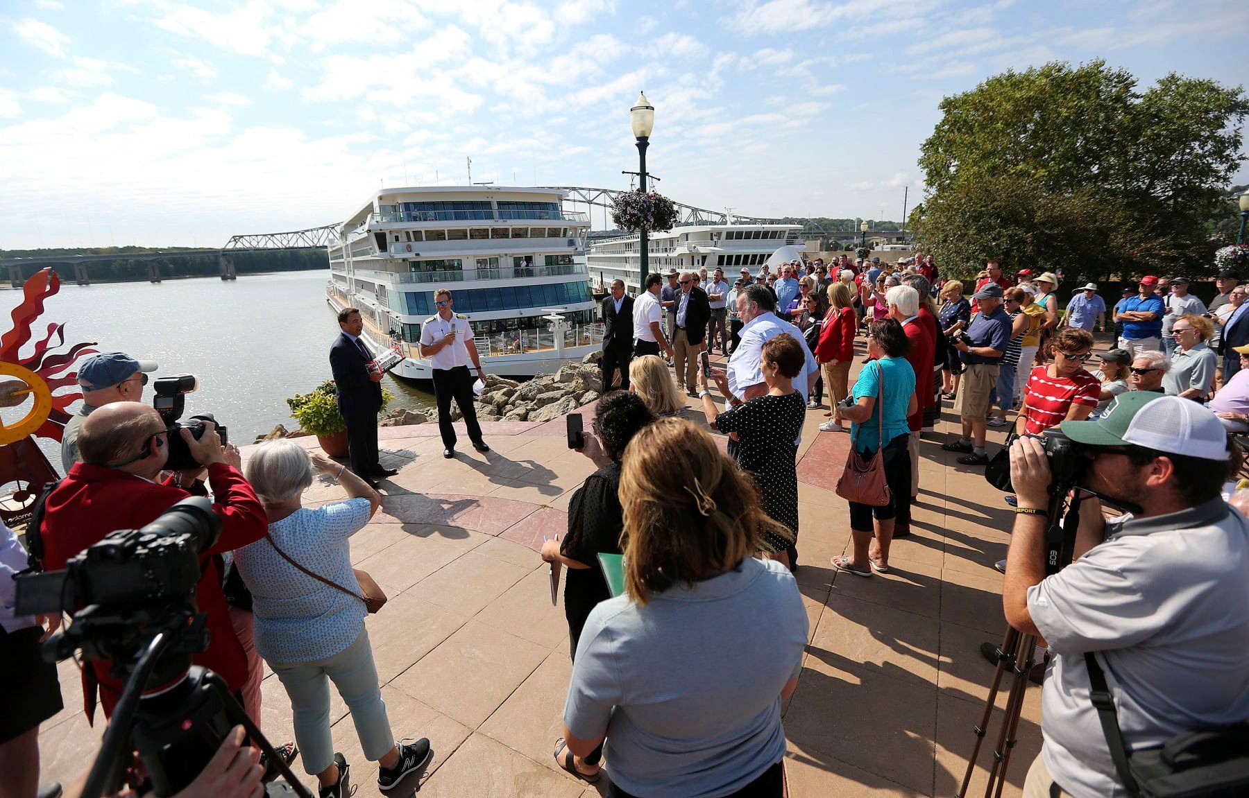 People gather at the Port of Dubuque for a ribbon-cutting for the Viking Mississippi cruise ship that docked for the first time on Tuesday, Sept. 6, 2022.    PHOTO CREDIT: Dave Kettering