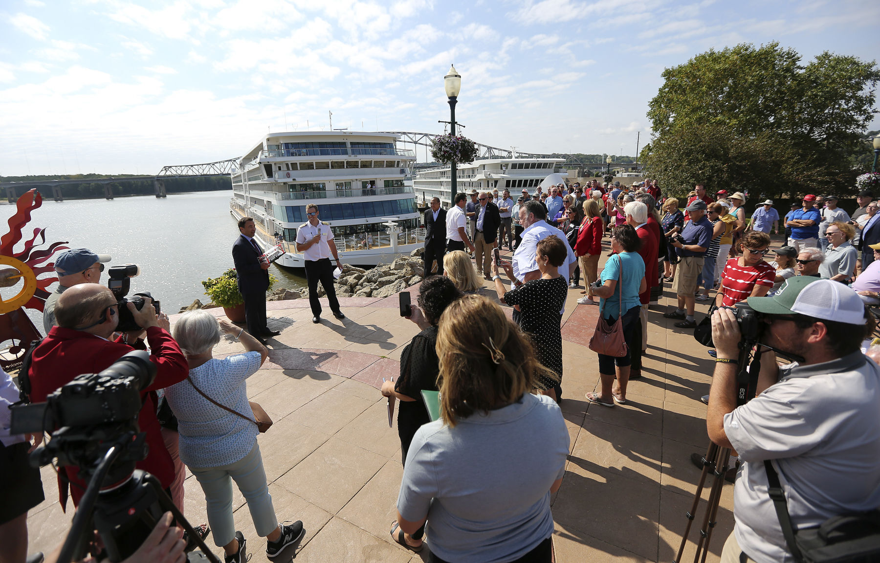 People gather at the Port of Dubuque for a ribbon cutting for the Viking Mississippi cruise ship that docked for the first time on Tuesday, Sept. 6, 2022.    PHOTO CREDIT: Dave Kettering