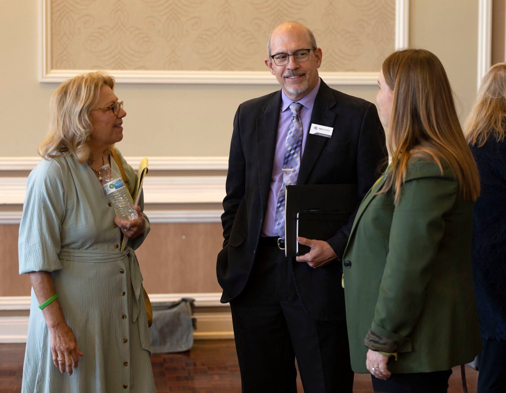 Iowa Sen. Pam Jochum, D-Dubuque, (left) speaks with FEH Design president Kevin Eipperle and Iowa Rep. Lindsay James, D-Dubuque before a panel discussion at the Dubuque Area Chamber of Commerce Legislative Conference at the Hotel Julien Dubuque on Wednesday, Sept. 7, 2022.    PHOTO CREDIT: Stephen Gassman