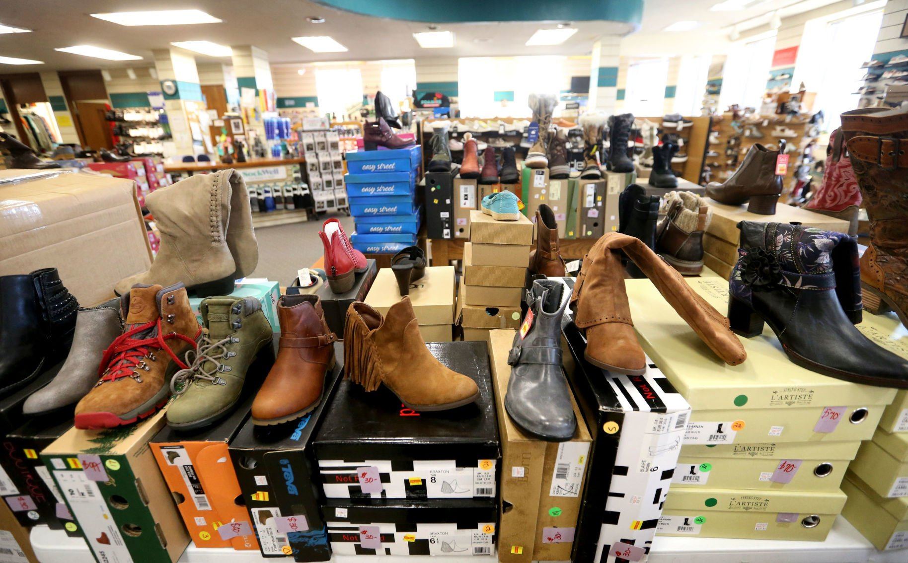 A wide range of footwear can be found at Cruisin’ Kids/Walker’s Clothing and Shoes in Lancaster, Wis. The store draws local residents, as well as customers from a “100-mile radius” that includes Dubuque.    PHOTO CREDIT: JESSICA REILLY