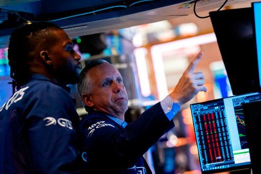 Traders work on the floor of the New York Stock Exchange. Stocks edged higher on Wall Street following the market’s worst day in two years on fears about higher interest rates and the recession they could create.    PHOTO CREDIT: Julia Nikhinson
