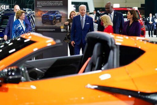 President Joe Biden listens during a tour at the Detroit Auto Show, Wednesday, Sept. 14, 2022, in Detroit. From left, Sen. Debbie Stabenow, D-Mich., Mary Barra, CEO of General Motors, Biden, Rep. Debbie Dingell, D-Mich., Ray Curry, President of the United Auto Workers, and Michigan Gov. Gretchen Whitmer. (AP Photo/Evan Vucci)    PHOTO CREDIT: Evan Vucci
