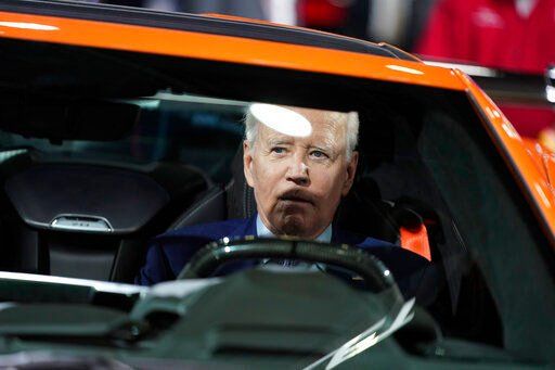 President Joe Biden sits in a Corvette during a tour of the Detroit Auto Show, Wednesday, Sept. 14, 2022, in Detroit. (AP Photo/Evan Vucci)    PHOTO CREDIT: Evan Vucci