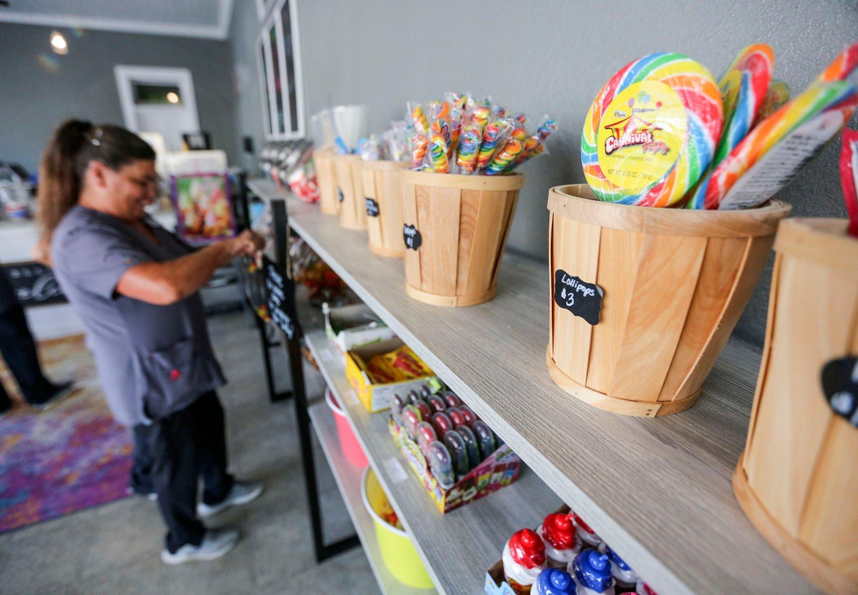 Theresa Schwager selects some candy from Sweet Boutique in Bellevue, Iowa, on Friday.    PHOTO CREDIT: Dave Kettering